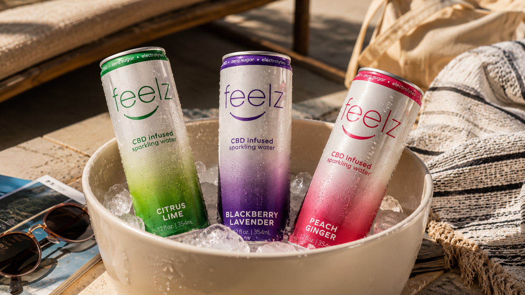 Feelz CBD Enhanced Sparkling Water can lineup in an ice bucket